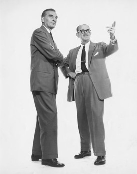 Two Businessmen Standing Together Poster Print - 18 x 24 in.