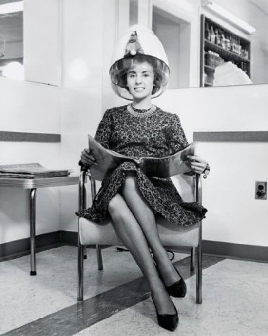 SAL2554854A Portrait of a Young Woman Sitting in an Armchair Under a Hair Dryer 1964 Poster Print - 18 x 24 in.