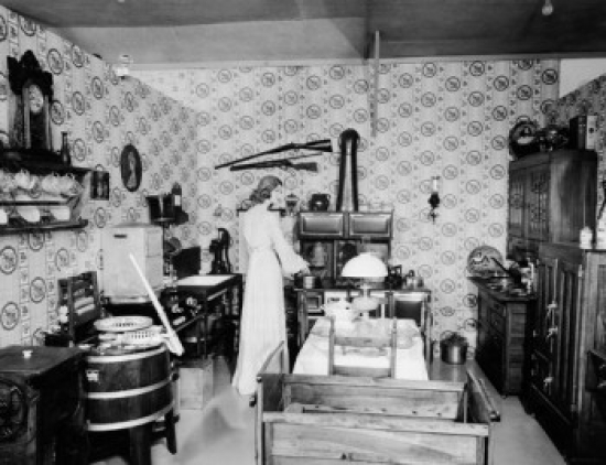 Rear View of a Young Woman Preparing Food in a Kitchen Pioneer Village Minden Nebraska USA Poster Print
