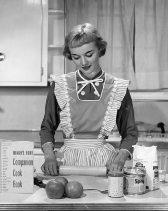 Young Woman Using a Rolling Pin in a Domestic Kitchen Poster Print 18 x 24 in.