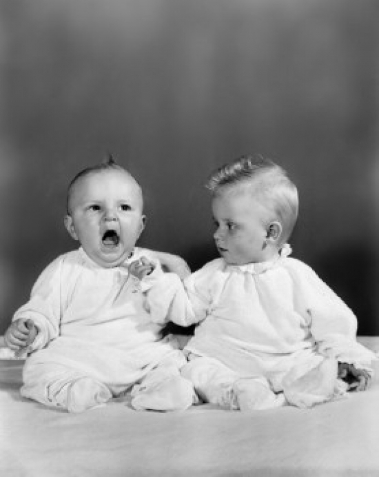 Two Babies Sitting Together Poster Print - 18 x 24 in.