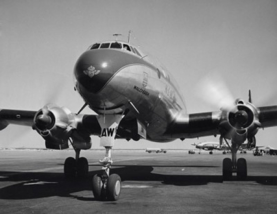 Low Angle View of an Airplane on a Runway Poster Print - 18 x 24 in.