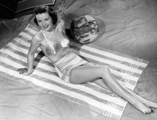 High Angle View of a Young Woman Reclining on the Beach Poster Print - 18 x 24 in.
