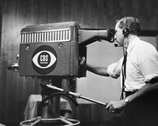 Side Profile of a Cameraman Operating a Television Camera Poster Print