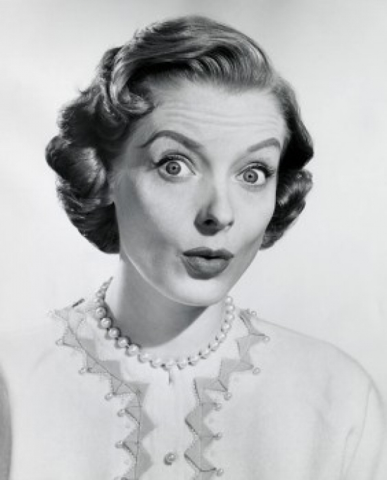 Portrait of a Young Woman Puckering Her Lips Poster Print - 18 x 24 in.