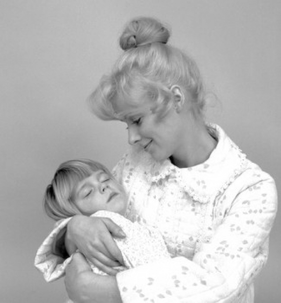 Mother Holding Sleeping Child Poster Print - 18 x 24 in.