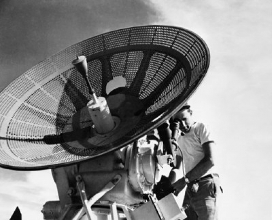 Engineer Operating a Radar Antenna Poster Print - 18 x 24 in.