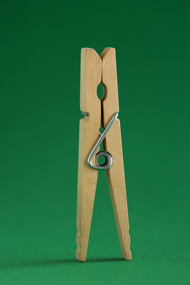 Clothespin On Green Background Poster Print by Steven Raniszewski - 13 x 20