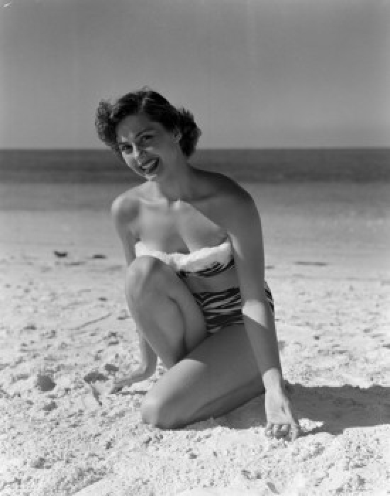 SAL255417921 Portrait of Pin-Up Girl Wearing Bikini Crouching on Sandy Beach Poster Print - 18 x 24 in.
