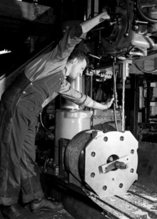 Man Working in Factory Poster Print - 18 x 24 in.