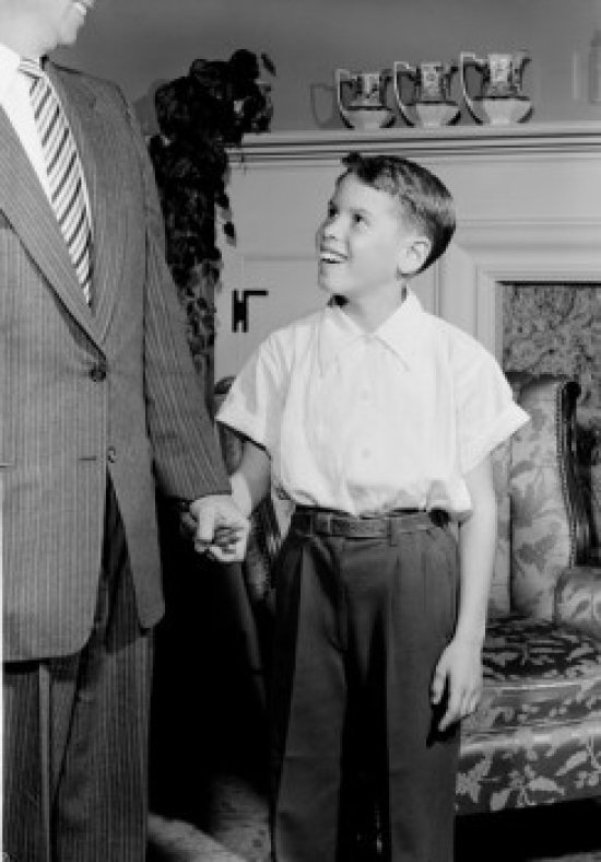 Boy with Father in Room Poster Print - 18 x 24 in.