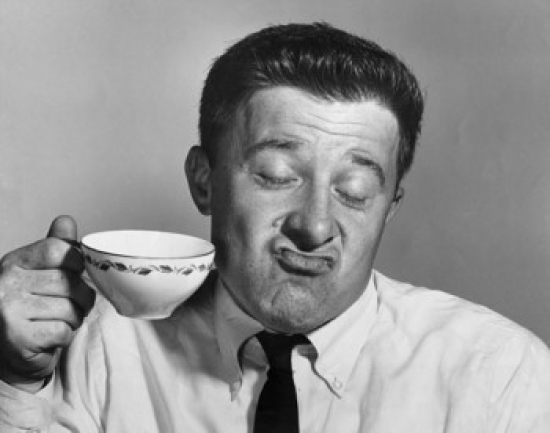 Mature Man Holding Tea Cup & Making a Face Poster Print - 18 x 24 in.