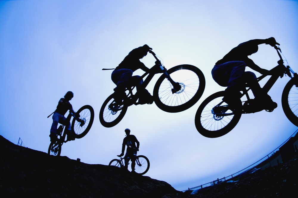 Stunt Cyclists Alberta Canada Poster Print by Corey Hochachka - 17 x 11