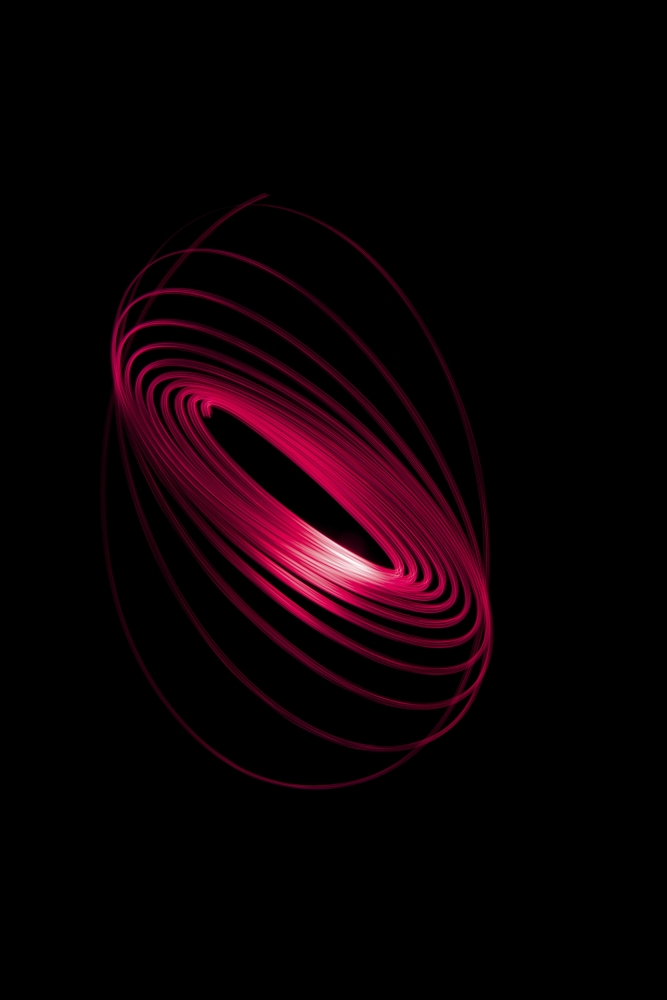 DPI12288068LARGE Red Light Curving in a Sphere Shape On A Black Background Poster Print by Nick Dale, 24 x 38 - Large