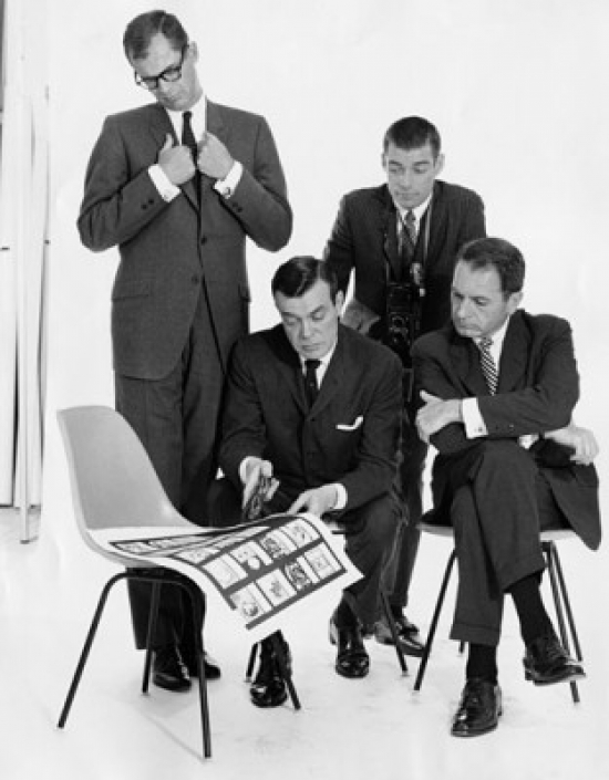 Four Mid Adult Men Talking Poster Print - 18 x 24 in.
