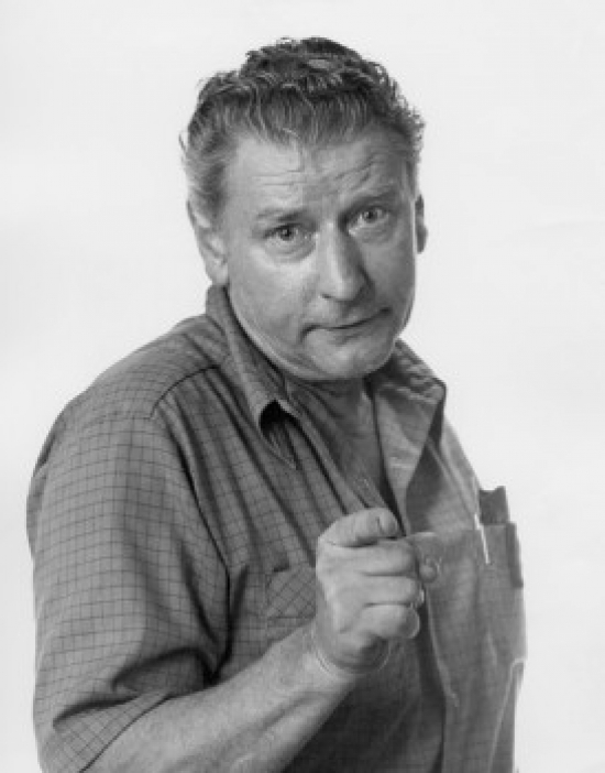 Pointing Mature Man Looking at Camera Portrait Poster Print - 18 x 24 in.