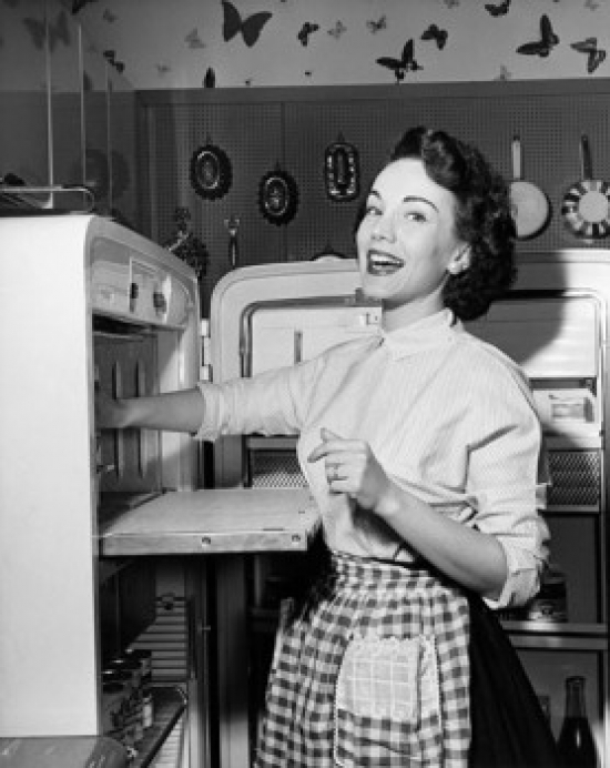 Portrait of a Young Woman Standing Near a Refrigerator Poster Print - 18 x 24 in.