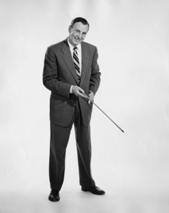 Studio Portrait of Businessman Pointing Downwards with Pointer Stick Poster Print - 18 x 24 in.