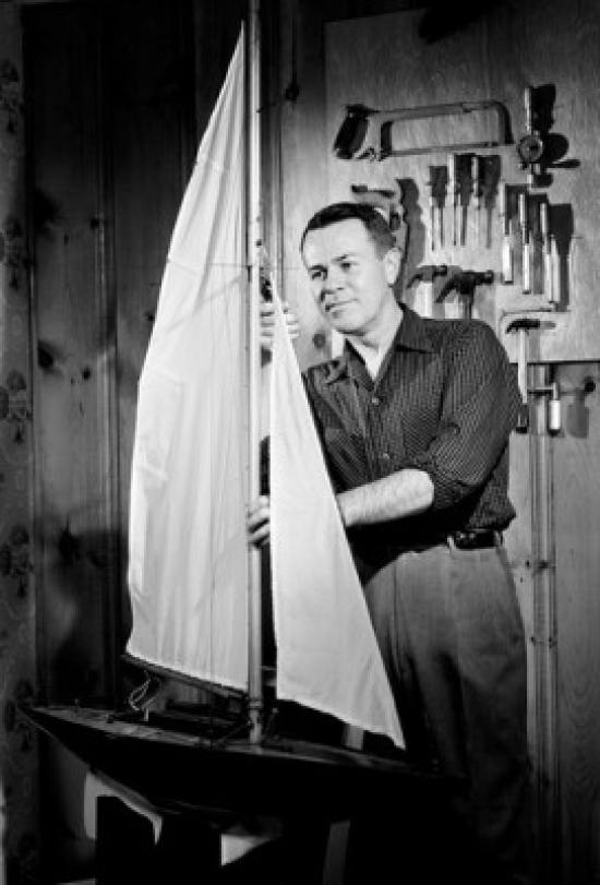 Man Building Model Ship Poster Print - 18 x 24 in.
