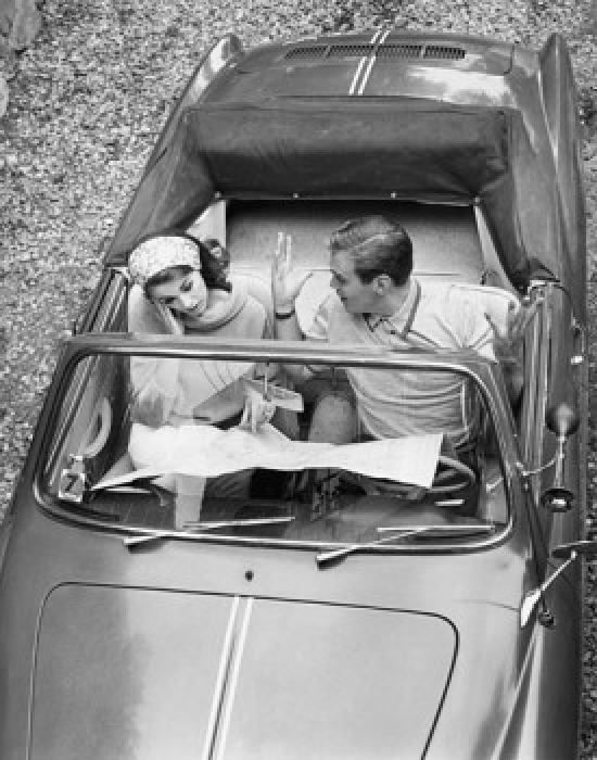 SAL25550050 High Angle View of a Young Couple Sitting in a Car & Reading a Map Poster Print - 18 x 24 in.