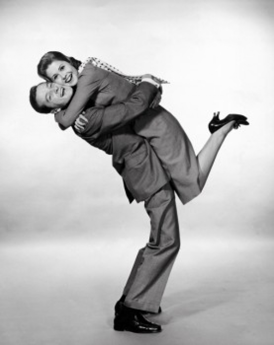Portrait of a Young Man Lifting a Young Woman Poster Print - 18 x 24 in.