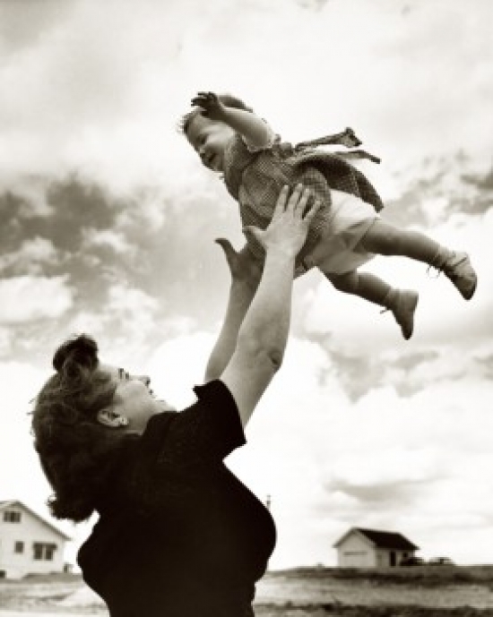 Side Profile of a Mother Tossing Her Daughter in the Air Poster Print - 18 x 24 in.