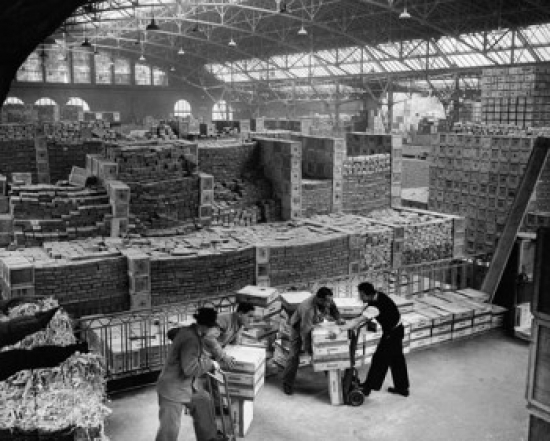 High Angle View of Four Workers in a Warehouse Poster Print - 18 x 24 in.