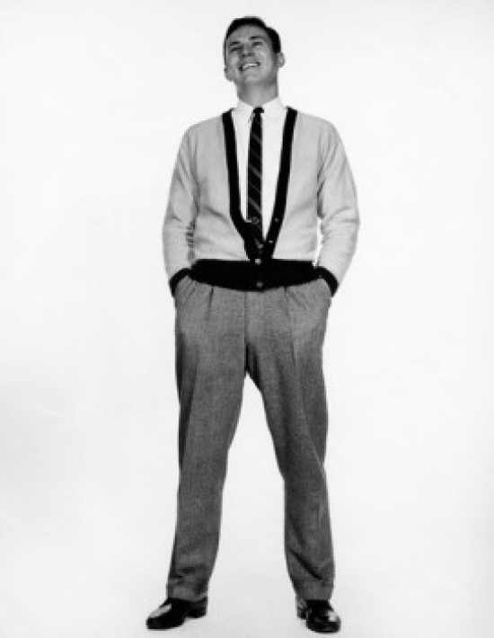 Young Man Standing with Hands in Pockets Poster Print - 18 x 24 in.