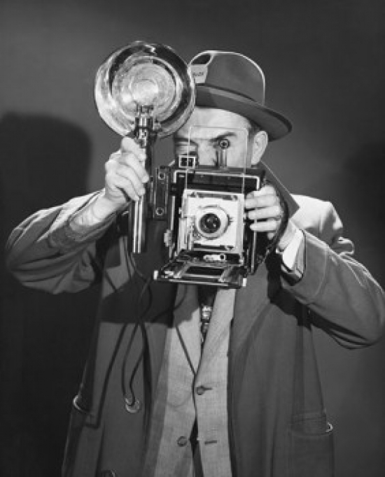 Photographer Holding a Camera Poster Print - 18 x 24 in.