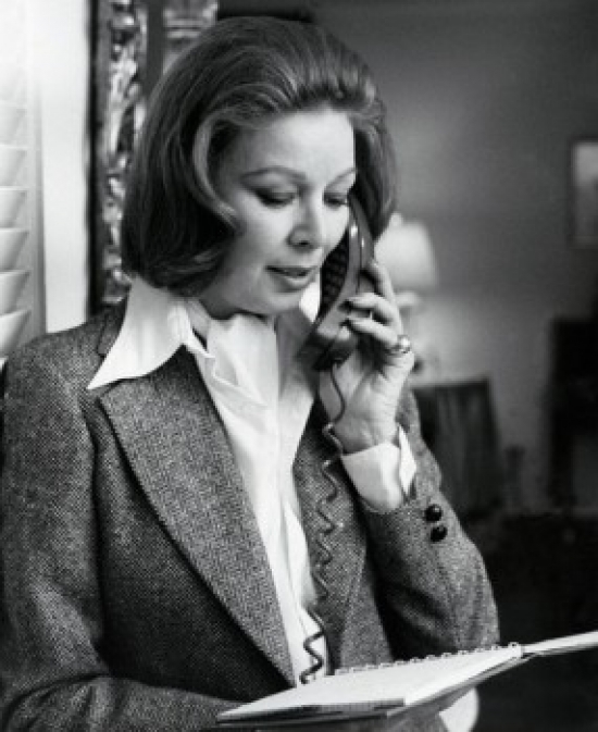 Woman Reading Document & Talking on Phone Poster Print - 18 x 24 in.