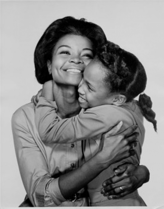 Mother Hugging Her Daughter Poster Print - 18 x 24 in.