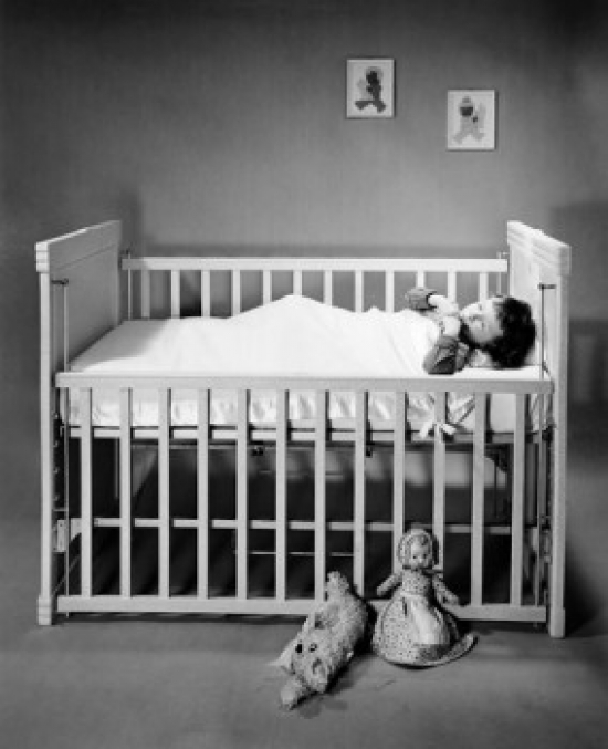 Boy Sleeping in Crib Poster Print - 18 x 24 in.
