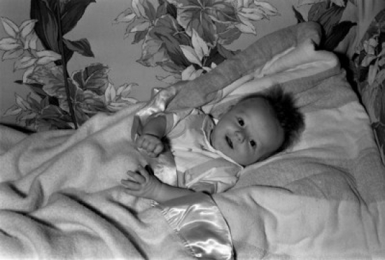 Baby Lying in Bed Poster Print - 18 x 24 in.