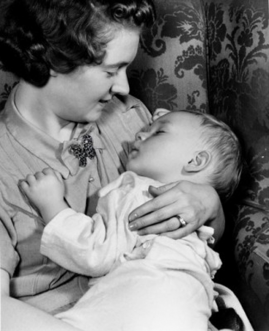 Mother Holding Sleeping Child Poster Print - 18 x 24 in.