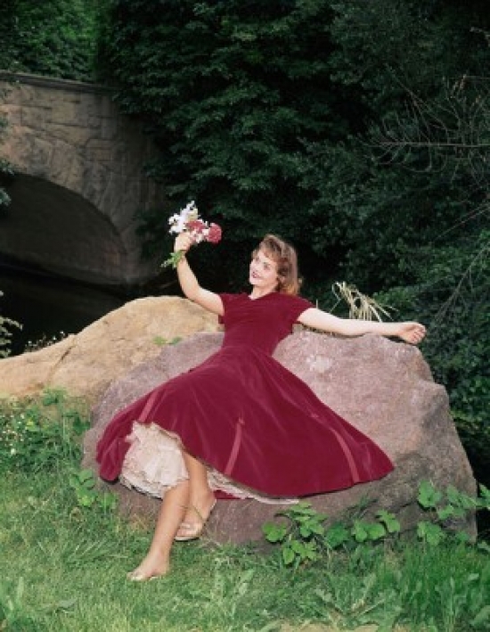 SAL3107326484 Young Woman Lying on a Rock & Holding a Bunch of Flowers Poster Print - 18 x 24 in -  Posterazzi