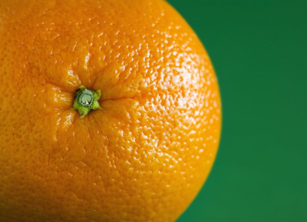 Orange Fruit On Green Background Poster Print by Steven Raniszewski, 36 x 26 - Large