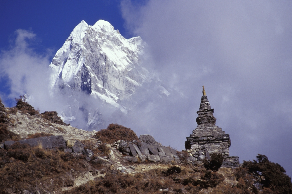 Snow Covered Peak with Cultural Monument in Forefront Poster Print by Sean White, 34 x 22 - Large