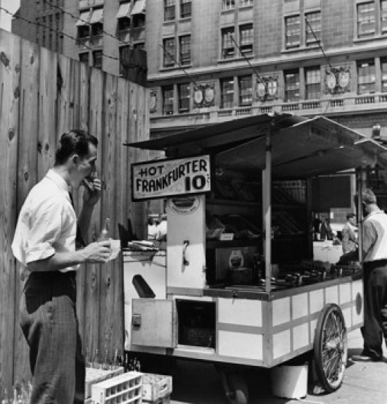 Mid Adult Man Eating Food Near a Hot Dog Stand New York City New York USA Poster Print - 18 x 24 in.