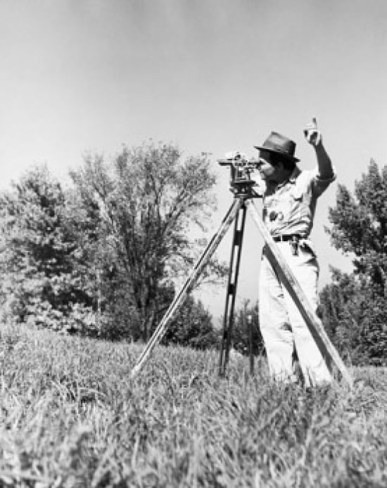 SAL25537129 Male Surveyor Standing in a Field & Looking Through a Theodolite Poster Print - 18 x 24 in.