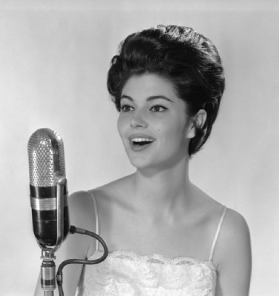 Young Woman Singing Into Microphone Poster Print - 18 x 24 in.