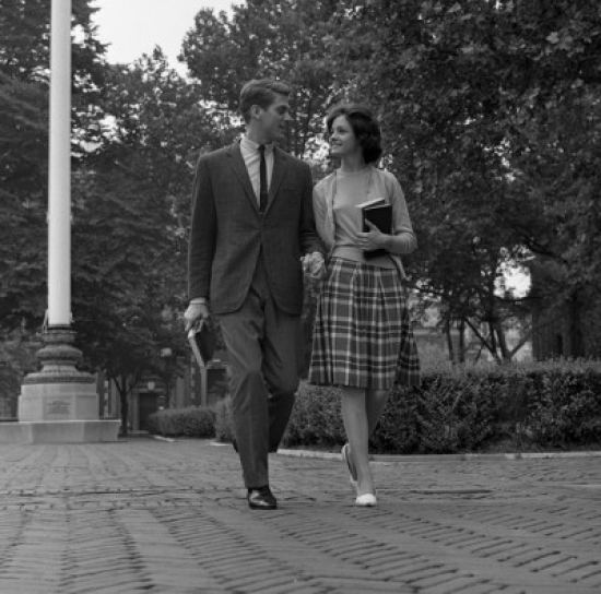 Young Couple Walking on Sidewalk Poster Print - 18 x 24 in.