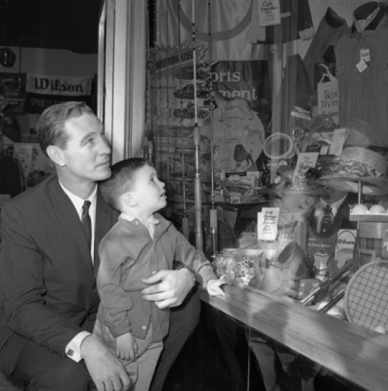 Father & Son Watching Window Display Poster Print - 18 x 24 in.