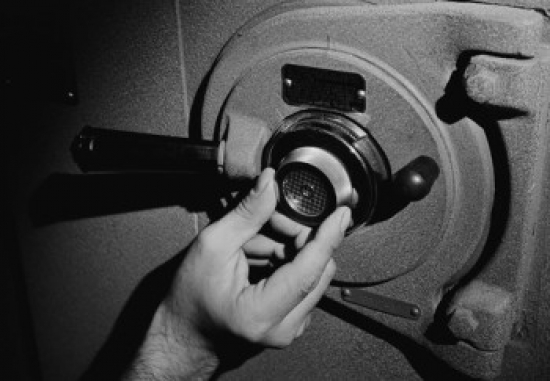 Mans Hand Unlocking Safe Poster Print - 18 x 24 in.