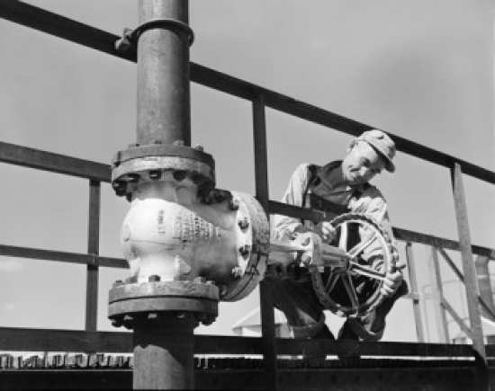 Worker Adjusting Valve on Pipeline Poster Print - 18 x 24 in.