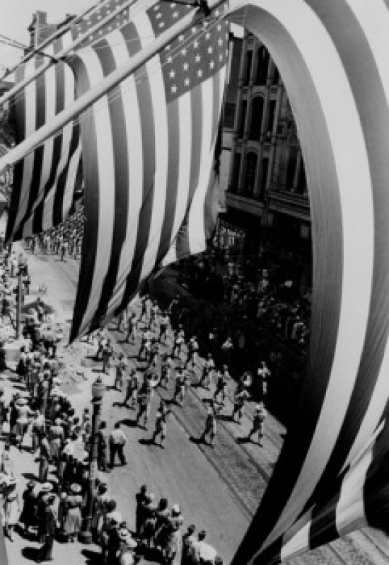 Framing Parade as Seen Through Flags & Poles Poster Print - 18 x 24 in.