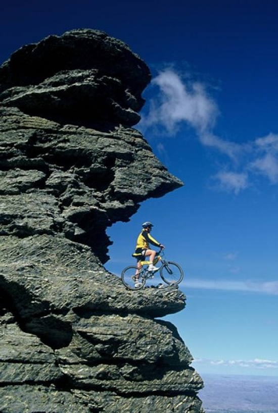 Mountain Biker & Rock Tor Dunstan Mountains Central Otago Poster Print by David Wall - 23 x 34 in.
