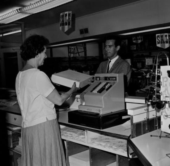 Customer & Clerk in Store Poster Print - 18 x 24 in.