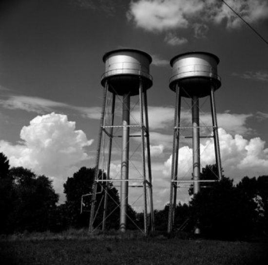 Water Tanks Against Cloudy Sky Poster Print - 18 x 24 in.