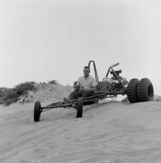 Man Riding Beach Buggy on Sand Dunes Poster Print - 18 x 24 in.