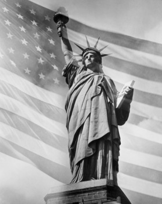 Low Angle View of a Statue with the American Flag in the Background Statue of Liberty New York City New York USA Poster Print - 18 x 24 in.